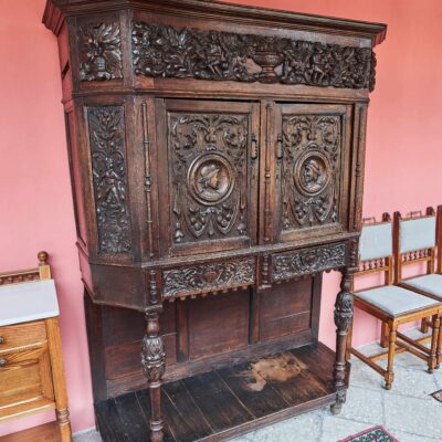 An unoresance carved cupboard from a massive oak
