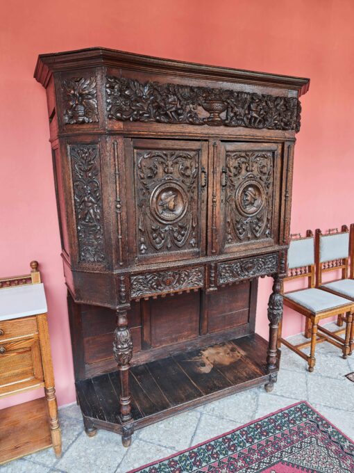 An unoresance carved cupboard from a massive oak